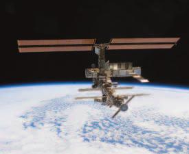 Figure 28-6 This photo shows the partially completed International Space Station as it orbits Earth.