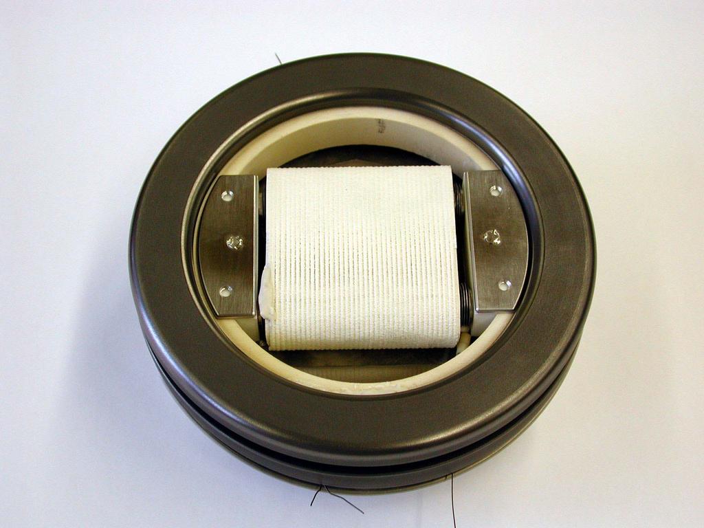 Fig. 4: Pick up coil with a graphite limiter ring. One coil stack is located in front of the liner close to the plasma and another one is placed behind the liner.