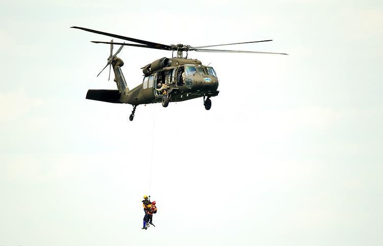 Unbalanced Forces A Rescue Helicopter lifts 2 people with a total mass of 200kg with an acceleration of 3.0m/s 2.