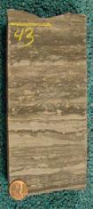 Shown are thin laminations in the Middle Bakken [LeFever 25], layering in the Woodford [outcrop photo courtesy of Halliburton], and large