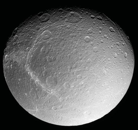 214 CHAPTER 8 Survey of Solar Systems Impacting body Mercury Dione FIGURE 8.15 Pictures taken by spacecraft showing craters on Mercury and Saturn s moon Dione.
