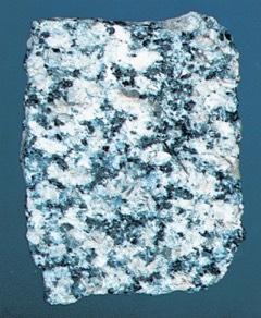 Has light-colored minerals such as quartz