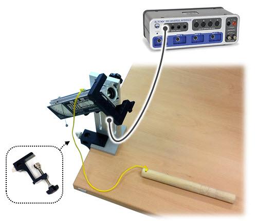 Whenever you shoot the ball, make sure the Photogate is in position.) Using the table clamps, clamp the Launcher to the left end of the table. Connect the Photogate to the interface.