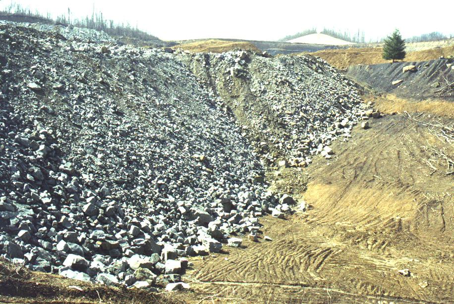 Large Durable Rock Valley Fill End-Dump Produces Low- Cost Internal Drainage What
