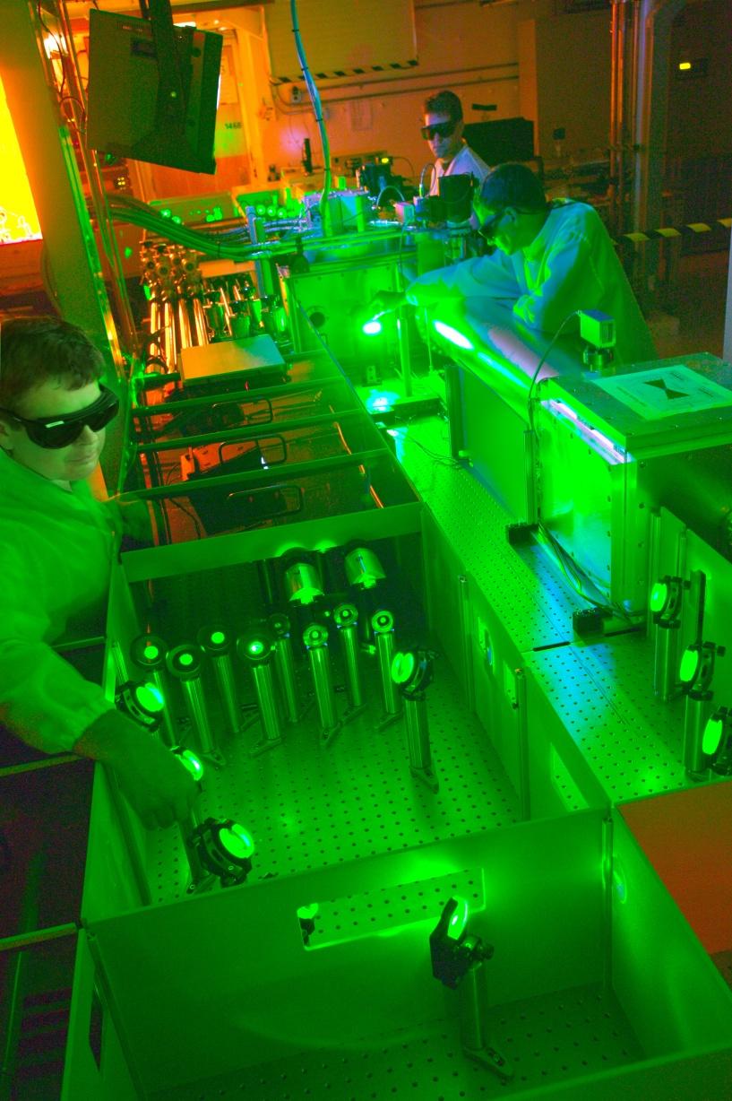Berkeley Lab researchers Csaba Toth (front) and Wim Leemans (middle) work with technician Joe Wallig to test