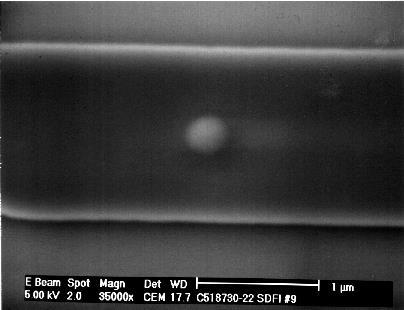 SEM/EDX analysis of a buried particle