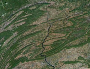 Appalachian Mountains This is an aerial view of the Susquehanna River in Pennsylvania flowing through the folded and faulted Valley and Ridge Province of the Appalachian Mountains.