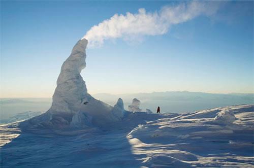 Ice Fumarole in Antarctica On Earth volcanic activity under the ice can create ice volcanoes or fumaroles where the steam