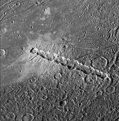 Chain Crater on Ganymede This is a chain crater formed from an object that broke up before impact,