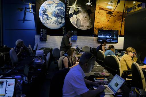 (AP Photo/Richard Vogel) Data Controller Nick Lam, monitors the Juno spacecraft inside Mission Control in the Space Flight Operations Facility at Jet Propulsion Laboratory, in Pasadena, Calif.