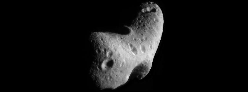 FIGURE 13.8 Looking Down on the North Pole of Eros. This view was constructed from six images of the asteroid taken from an altitude of 200 kilometers.