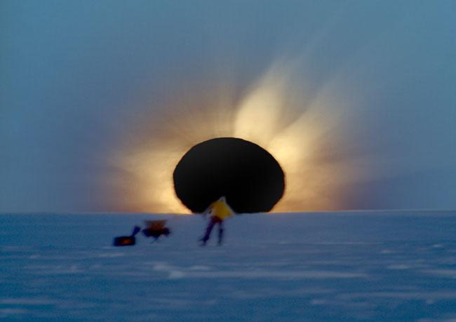 Cold Sun Eclipsed Credit: Fred Bruenjes This stunning eclipse photo was taken on the frigid snow of Antarctica.