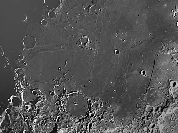The picture above has four formations marked: the red circle is a crater, the yellow line is a rift, the white circle is another crater, and the black arrows are pointing to the Mare of the Moon.
