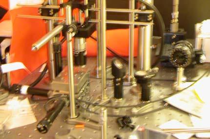 The thin line path shows two possible destinations, the CCD camera to help align the sample, and the optical fiber coupled to the spectrometer. Figure 2.8.
