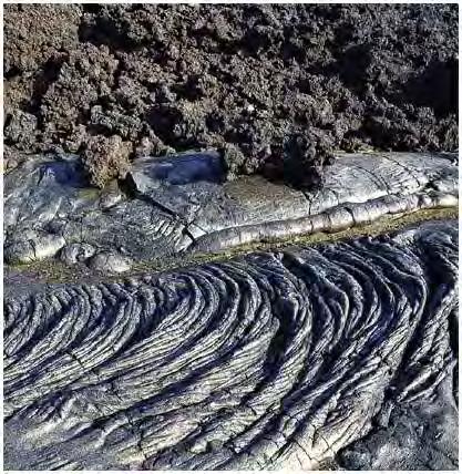 Pahoehoe: Hawaiian for ropy. Highly fluid Aa: Hawaiian for ouch. This is pahoehoe that has cooled and lost gases.