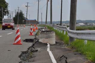 Photo 14 shows one of the typical phenomena of liquefaction observed inland on a municipal road in Kashima-ku, Minamisoma City.