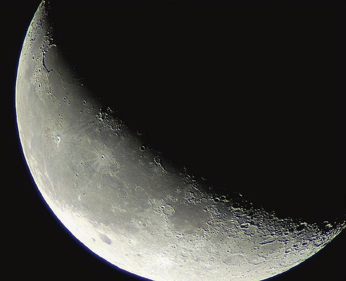 Fig. 2.1. Waning crescent moon showing differences in cratering density between maria (darker gray) and the highlands (gray-white).