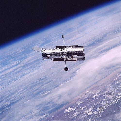 Hubble floating above Earth The Hubble Space Telescope has had a major impact in