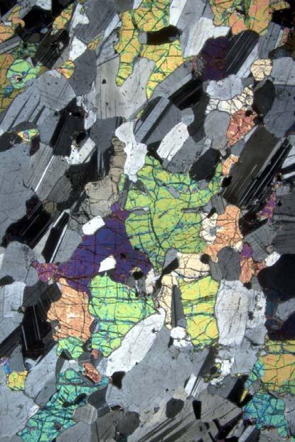 Why use the petrographic microscope? Identify minerals (no guessing!