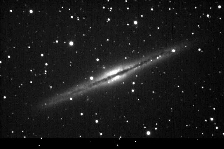Images from Badlands Observatory NGC 891 Spiral Galaxy in Andromeda: 9/7/00, Exposure 100 seconds --This galaxy, also similar to our own Milky Way, is seen almost exactly edge on.