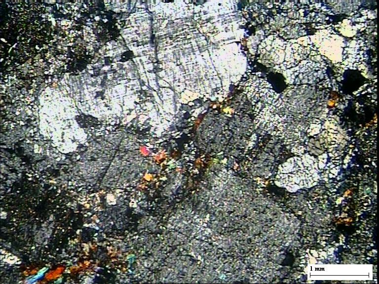 Fresh microcline (Micrl) and sericitized plagioclase (Alt-Plg)in Bonai granite,note myrmekitic intergrowth(mi) and relict twinning in plagioclase feldspar, Quartz is strained
