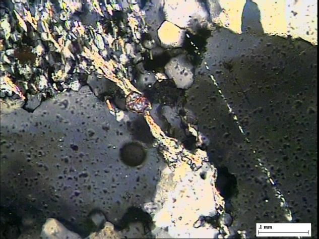 In some samples, chalcopyrite is also noticed as inclusion within quartz. [Fig. 6.2 (7)]. Zir Zir Pebble Fig.6.2(5).