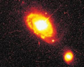 A B Figure 31-13 M87 is a large radio galaxy (A). In addition to radio lobes, M87 has a jet of gas that emits visible light (B).