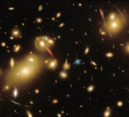 Figure 31-19 This distant cluster of galaxies, Abell 2218, allows astronomers to look back into time. Using Numbers The time since the expansion of the universe began can be calculated by t = 1.