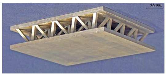 2 Chapter 1. Introduction Figure 1.1: Model of an extruded/electrodischarge-machined pyramidal lattice sandwich structure.