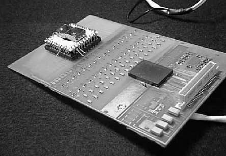 The VA-TA is mounted under the protective cover on the right side. The VA- TA is read out by a commercial DAQ board, which is in turn controlled by a PC/14 computer.