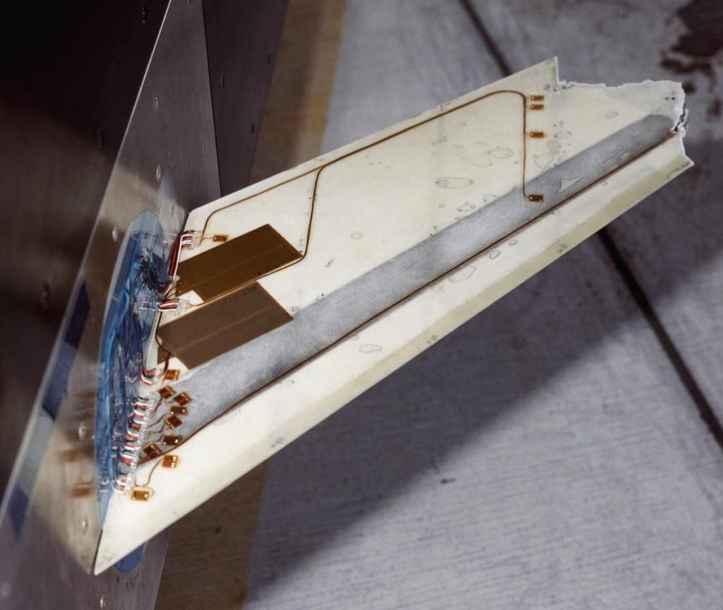 Figure 1-8 Aircraft Wing Model with Piezoelectric Actuators (http://nasaimages.org) unit and a feedback controller is utilized to send a control signal to the piezoelectric actuator.