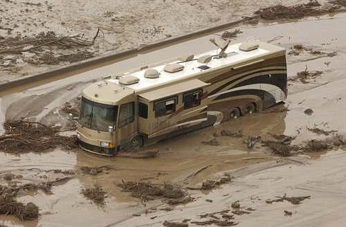 A motor home is stuck in the mud on