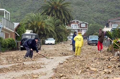 La Conchita residents clear a path for water
