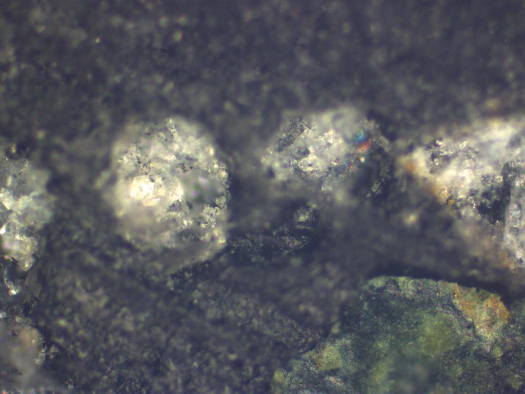 Figure 16 ~ Sand Contaminant 20x Zoom In figure 16 (sand contaminant) the heated sand appears to look like glass.