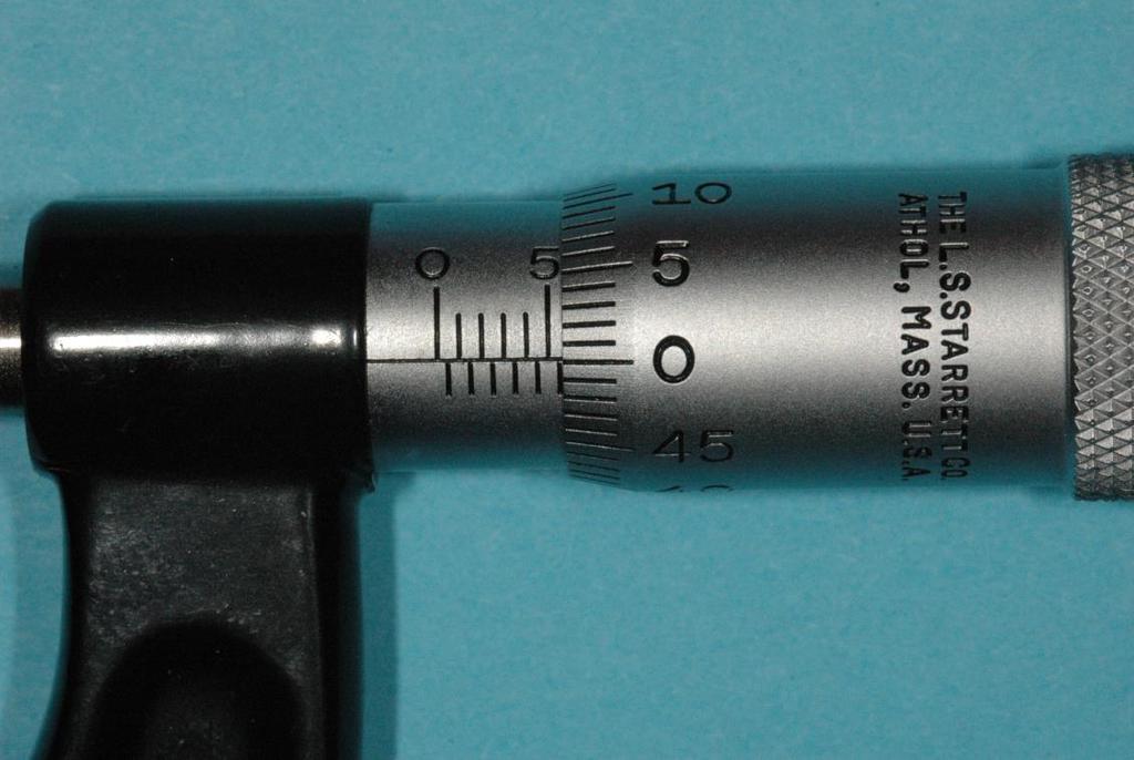 The spindle of an ordinary metric micrometer has threads per millimeter, and thus one complete revolution moves the spindle through a distance of 0.5 millimeter.