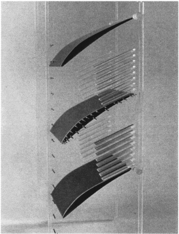 Fig. 5 Photograph of cascade and endwalls Fig. 6 Oil streak lines on suction side, M 1 Ä0.6, ReÄ0.8Ã10 6 turbulence level without a grid installed was measured to be 0.7 percent.