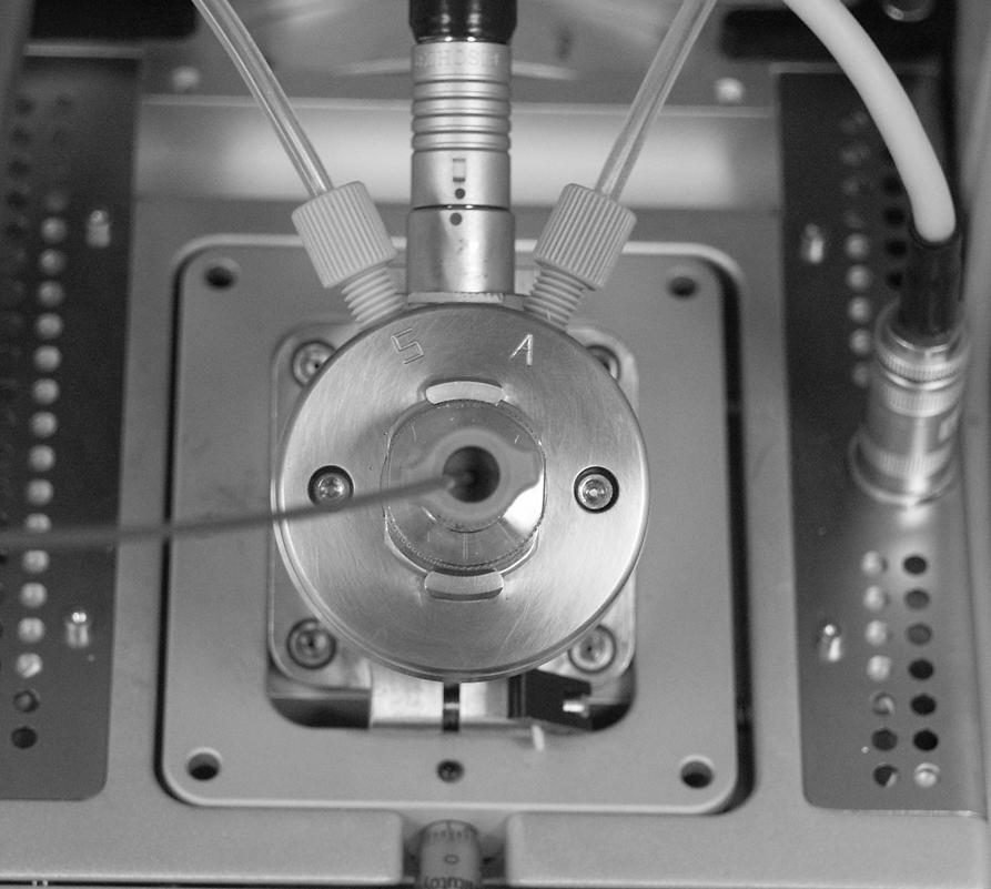 Setting Up the Ion Source for Tuning and Calibrating the Mass Spectrometer Removing the APCI Probe Removing the APCI Probe This topic describes how to remove the APCI probe.