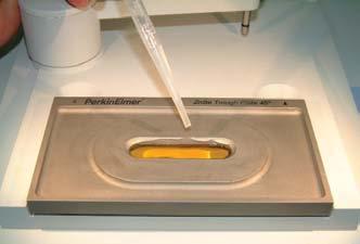 Using a pipette to add a liquid sample to a ZnSe
