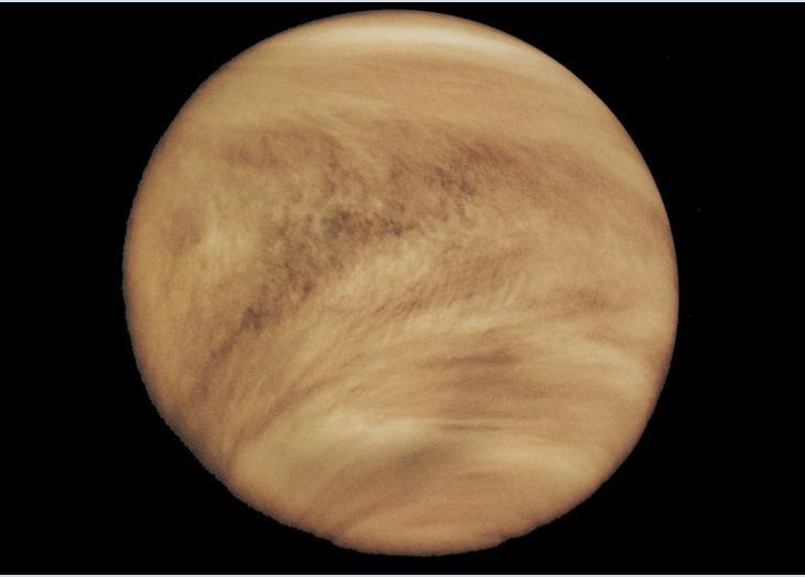 VENUS Venus' thick, toxic atmosphere traps heat in a runaway "greenhouse effect." Gravity 0.9 times the earth!