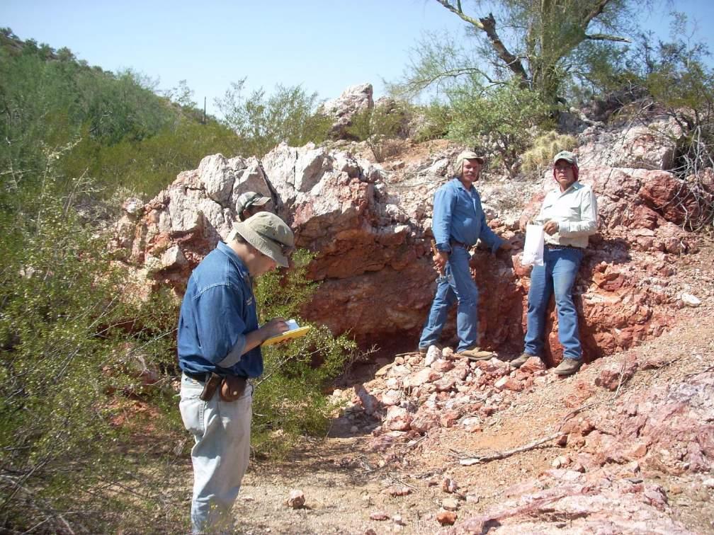 brecciated. Photo 3 shows a representative exposure. The main quartz vein exposed at a prospect pit is 1.5 m wide and strikes N50W.