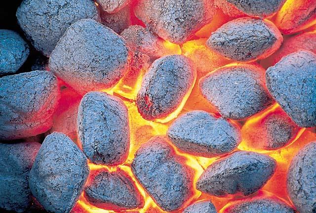 The charcoal used in a grill is basically carbon. The reacts with to yield.