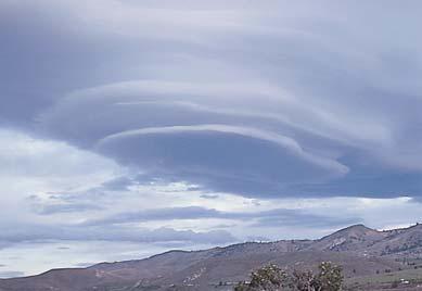 Lenticular clouds: Lens-shaped clouds downwind of mountains. Sometimes confused with flying saucers (Fig. 5.24, p. 127) Mammatus (same root as mammal ) resemble cow s udders.