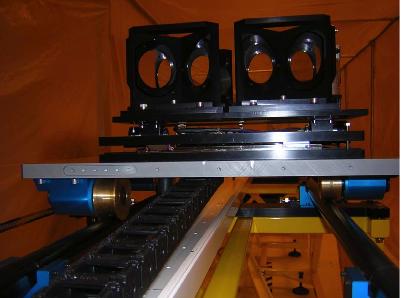 The translation stage on the front optical table is the Aerotech 1 m stroke stage. The total length of the delay line is 14 m. Right : view of the central carriage with the four dihedrals. 7.