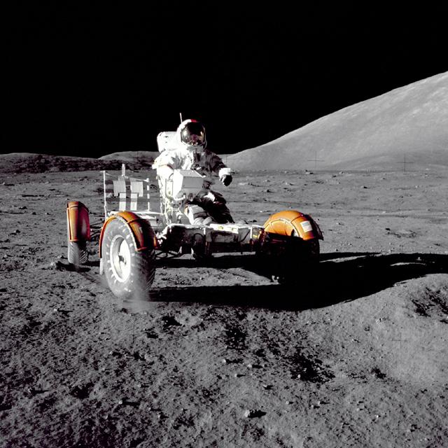 This photograph of Apollo 17 Commander Eugene Cernan driving the lunar rover on the Moon in 1972 looks as though it was taken at night with a large spotlight.