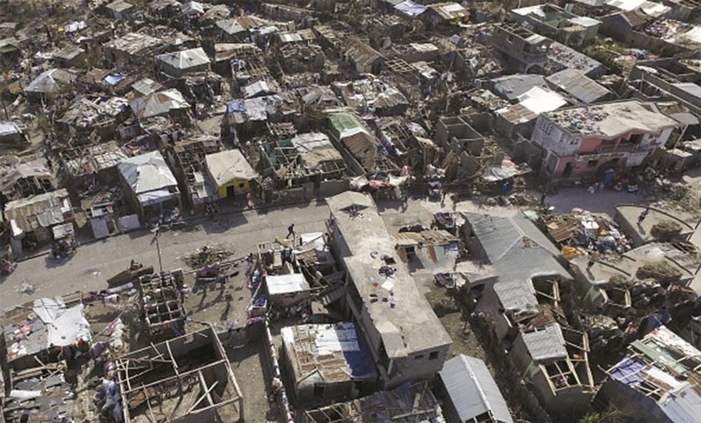 8 Study Figure 5, a photograph showing the effects of Hurricane Matthew in south western Haiti.