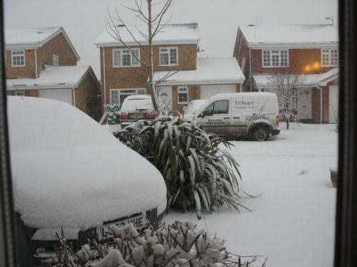 Annotate the photograph below describing the social, economic and environmental impacts of severe snowfall in the UK (include impacts you might not be able to see in the image): Extreme weather