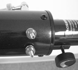 Figure 2-17 Aligning the Finderscope Use the following steps to align the finderscope: 1. Locate a distant daytime object and center it in a low power (20mm) eyepiece in the main telescope. 2. Look through the finderscope (the eyepiece end of the finderscope) and take notice of the position of the same object.