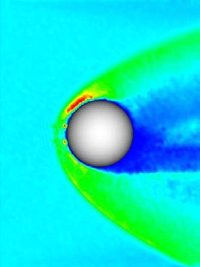 The solar wind flow is coming from the left. The spherical shell illustrates Venus. See Jarvinen et al. (2010b; Run 4), for the details of the run. The unit of the axes is the radius of Venus.