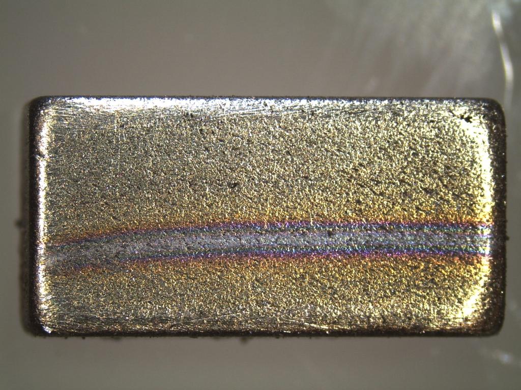 A. Burn Lines During periods of extended operation, centered dark lines and at times colored bands appear on the surface of the magnets. These discolorations are associated with current collection.