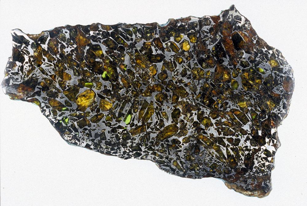 STONY IRON METEORITES (50% nickel- iron and 50% silicate material ): Stony- iron meteorites contain approximately even amounts of silicates and nickel- iron alloy 1-2% of meteorites.